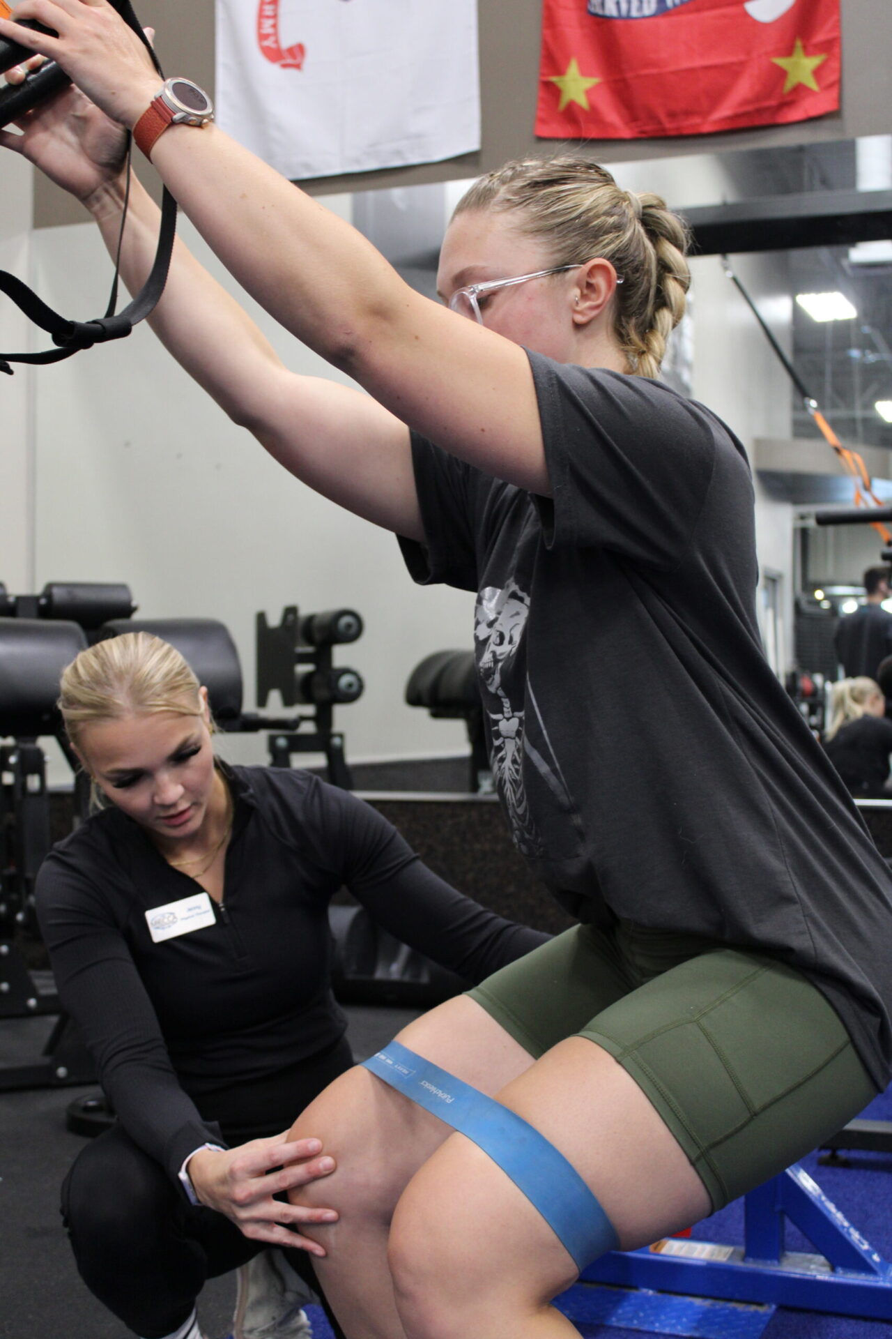 revitalize recovery dr. jenny helping patient with trx bands